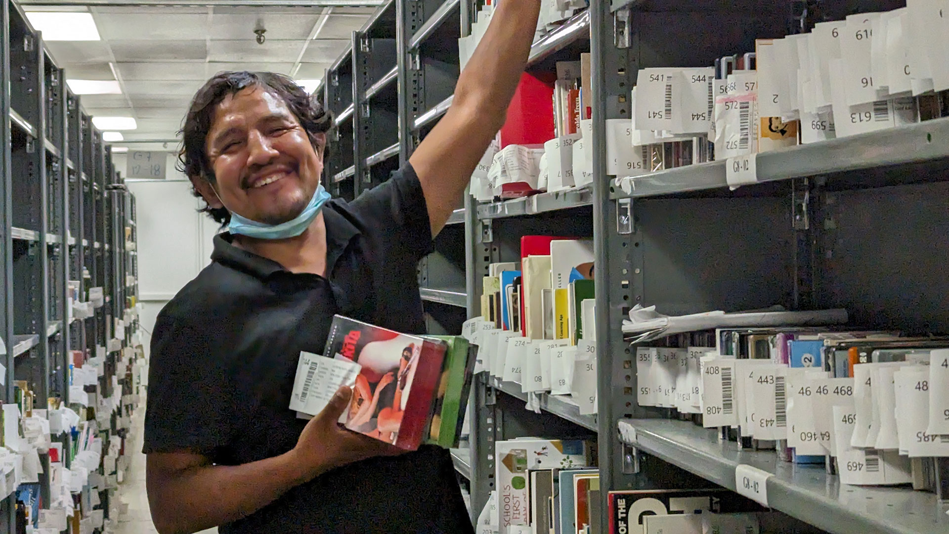 Green Street Books employee working with catalogued books