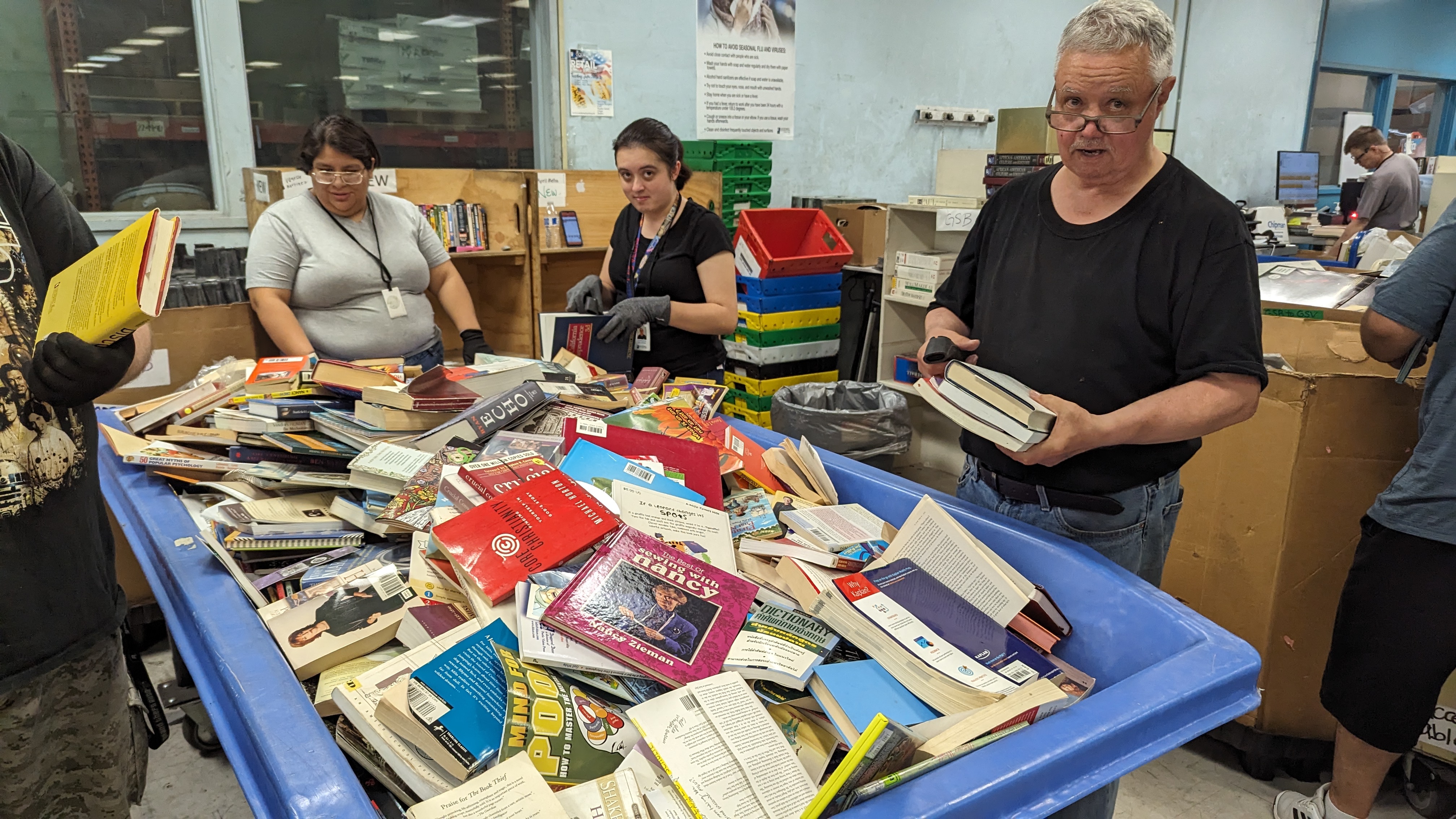 Green Street Books employees sorting donated books